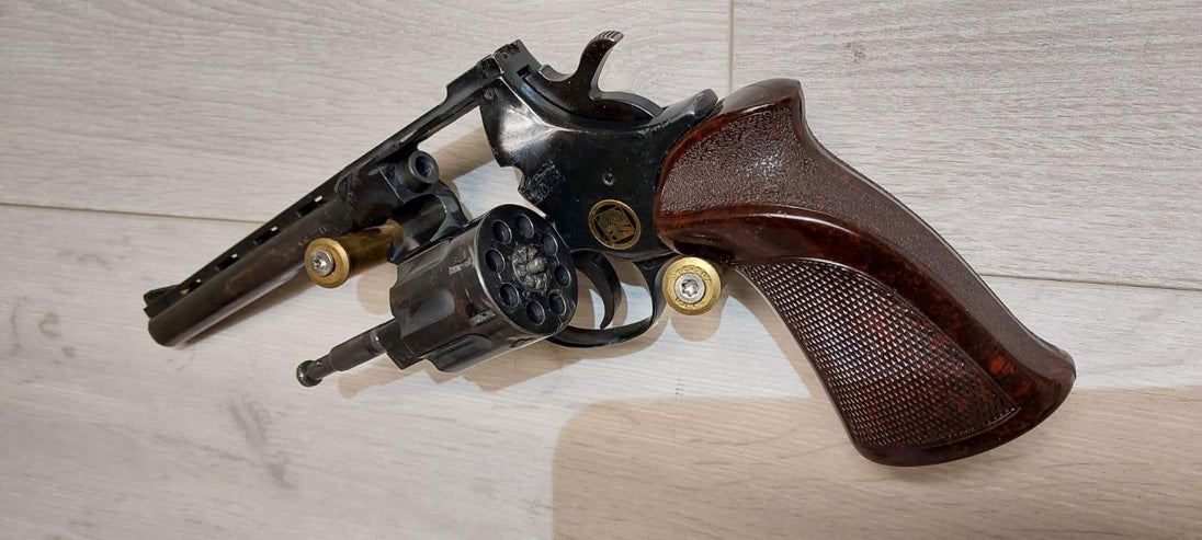 Revolver with wooden grip and ammunition, ideal for collectors and shooting sports