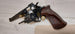 Revolver with wooden grip and ammunition, ideal for collectors and shooting sports