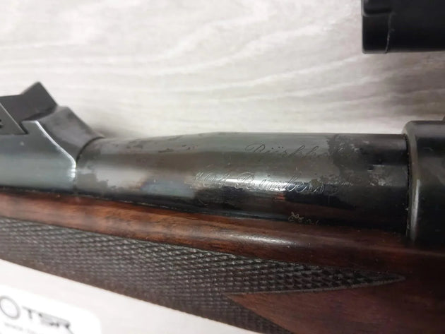 Rößler .304 Rößler rifle with engraved barrel and wooden stock, ideal for hunting and sport shooting.