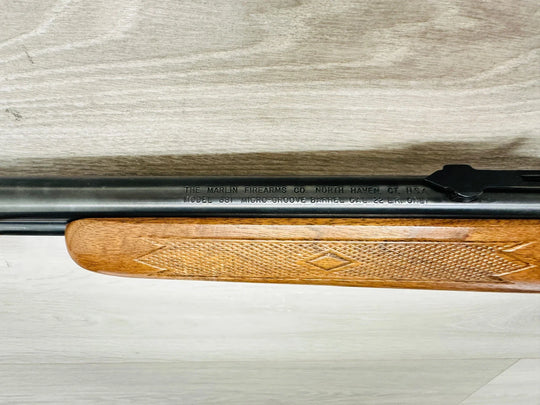 Marlin Model 681 .22 LR rifle with wood stock and micro-groove barrel, ideal for target shooting and small game hunting.