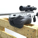White precision rifle with scope on Ulfhednar shooting bag, set on wooden pallet for target practice.