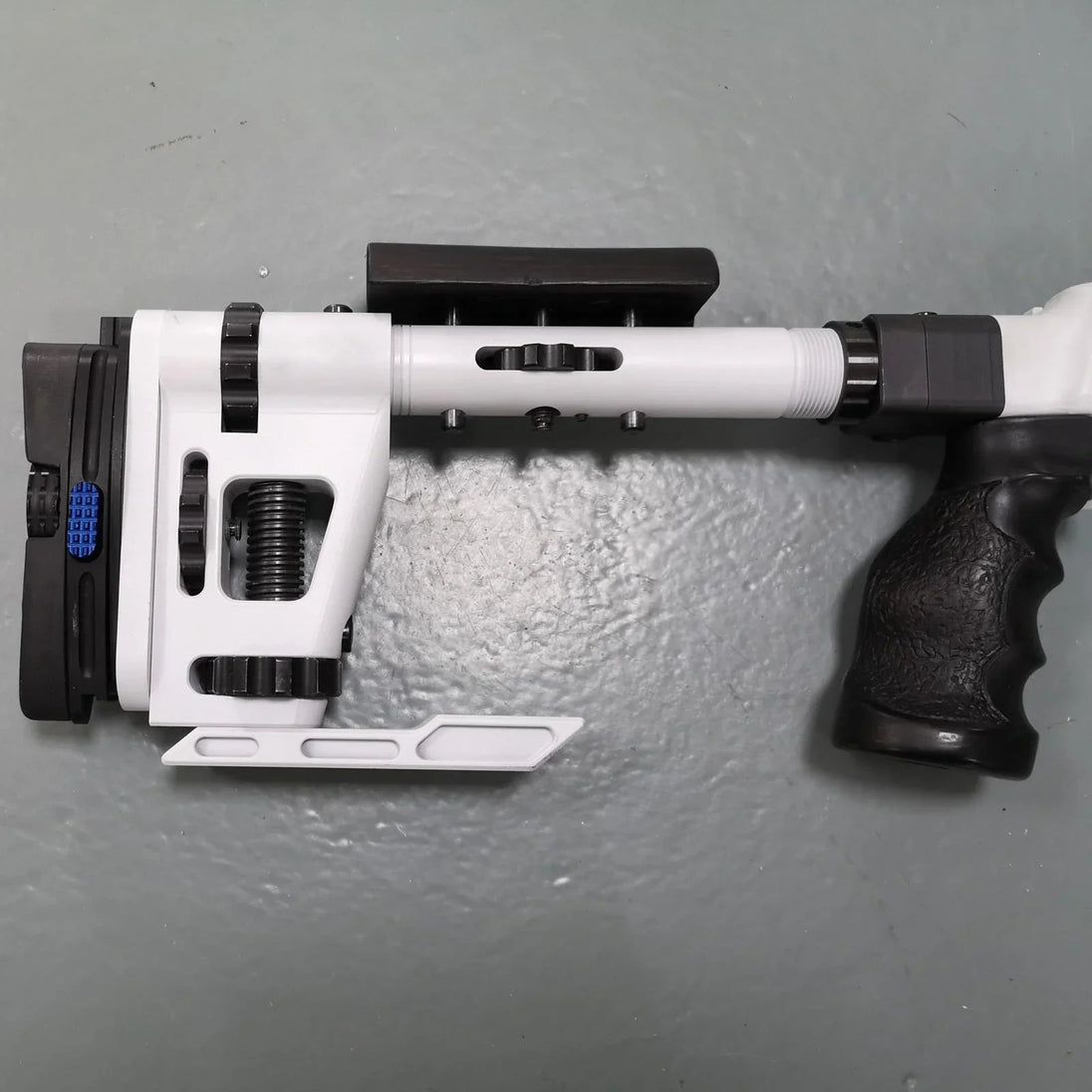 White and black adjustable shooting rest for precision target practice and competition
