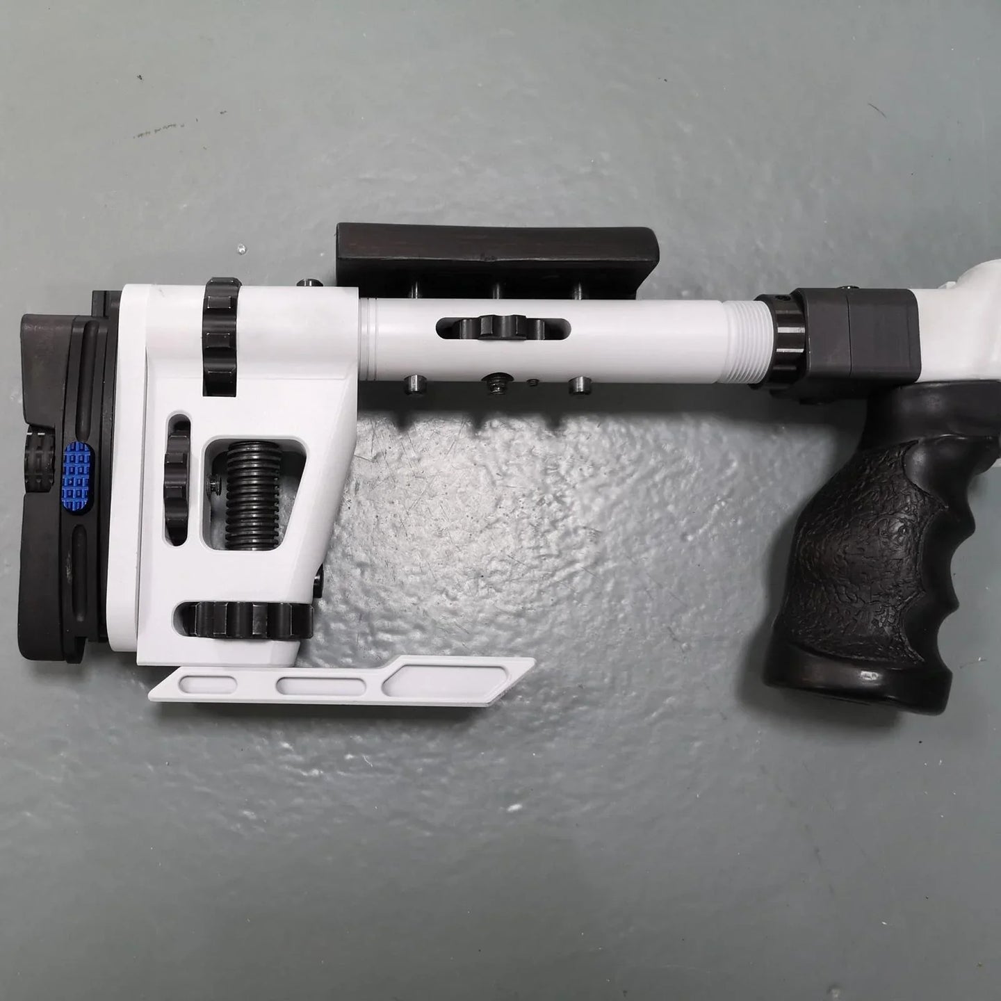 White and black adjustable shooting rest for precision target practice and competition
