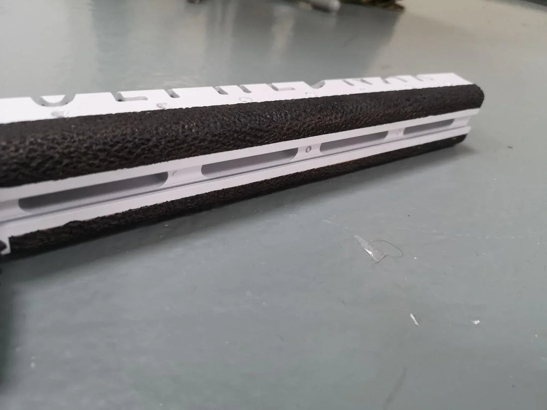 White and black textured rifle stock for competition shooting, hunting, or military use