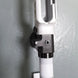 White competition rifle stock with adjustable black cheek rest for precision shooting