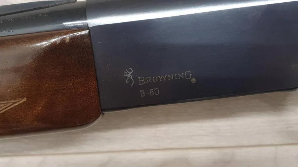Browning B-80 shotgun with wood stock, ideal for hunting and sport shooting.