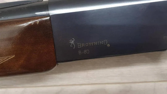 Browning B-80 shotgun with wood stock, ideal for hunting and sport shooting.