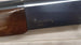 Browning B-80 shotgun with wood stock, ideal for hunting and sport shooting.