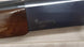 Browning B-80 shotgun with wood stock, ideal for hunting and sport shooting.