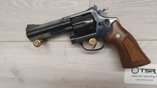 Revolver with wooden grip and ammunition, ideal for sport shooting and hunting