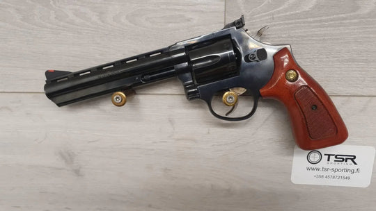 Revolver with wooden grip and cartridges, for sport shooting and hunting