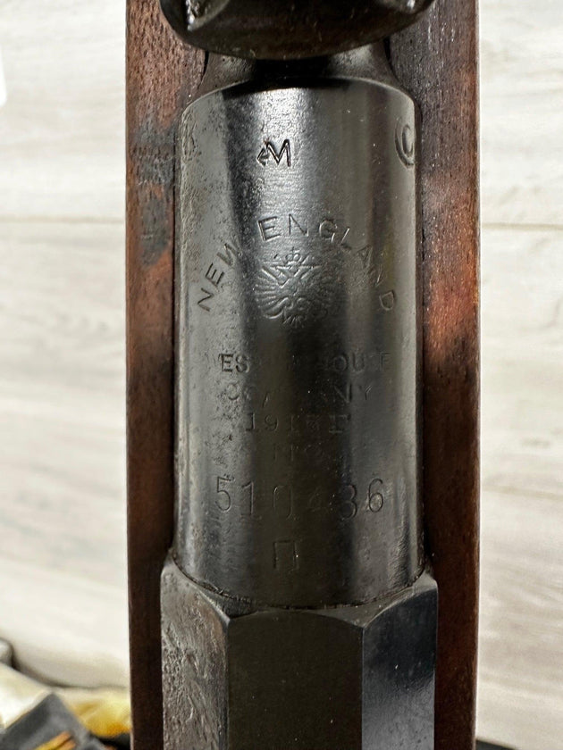 Vintage New England rifle receiver with engraved markings and wooden stock, collectible militaria